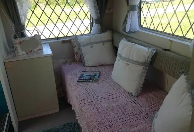 Kitty Unique 60s Caravan Set In Pretty Garden