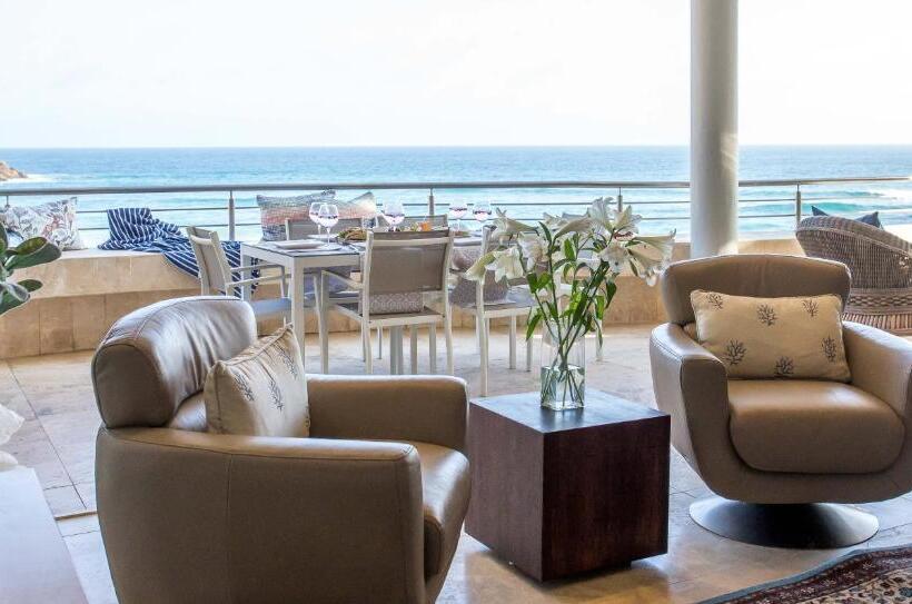 بنسيون Waves Of Grace Seafront Villa