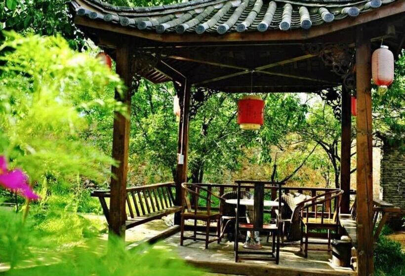 Отель Lijiang Baisha Holiday Resort