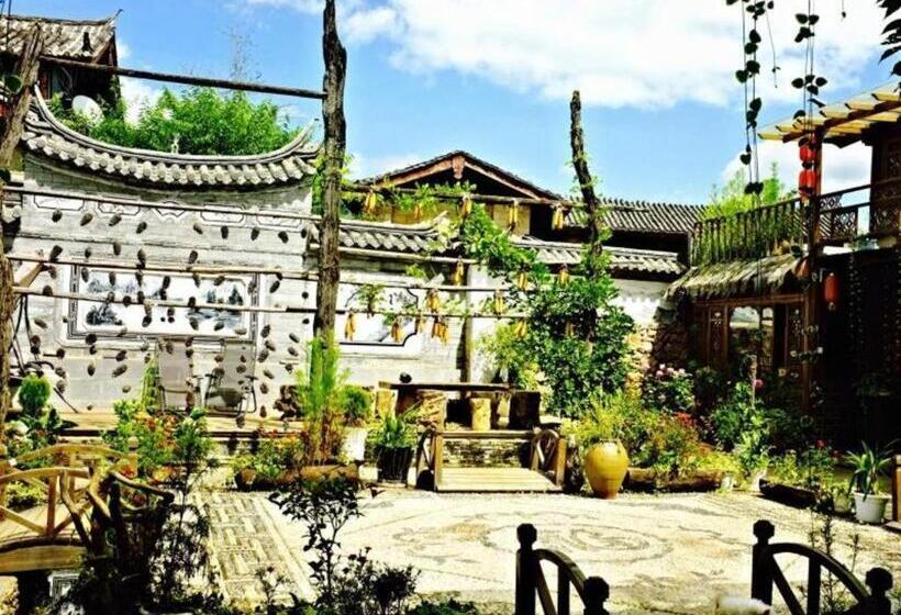 Отель Lijiang Baisha Holiday Resort