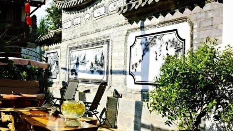 Отель Lijiang Baisha Holiday Resort