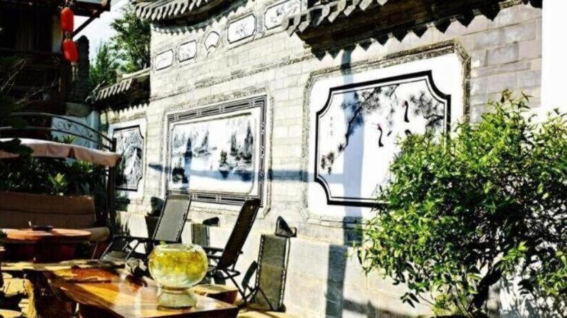 Отель Lijiang Baisha Holiday Resort