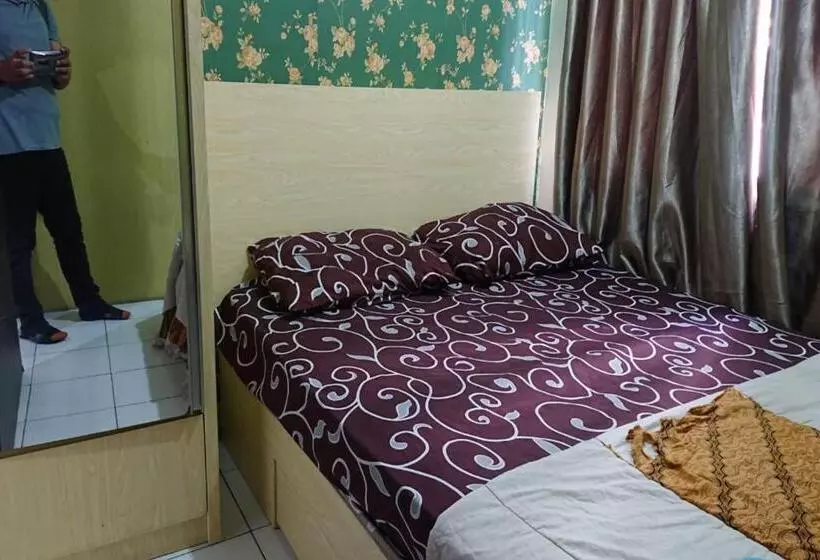 Hotelli Oyo Life 93139 Apartemen Grand Sentraland By Evi