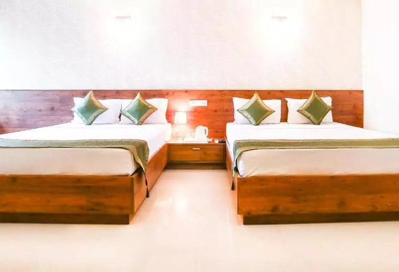 Hotelli Treebo Comforts Inn, University Road Deralakatte