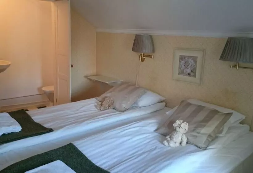 Majatalo L Floras Trädgård