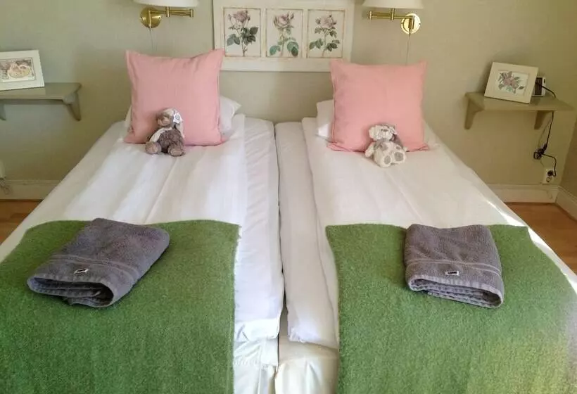 Majatalo L Floras Trädgård