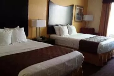 Отель Paradise Inn & Suites