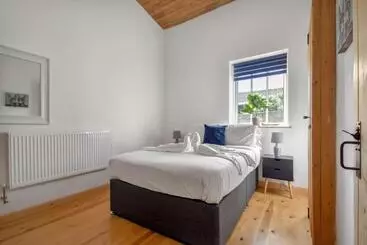 ツーリストアパートメント The Flint Barn At Quex Park Estate