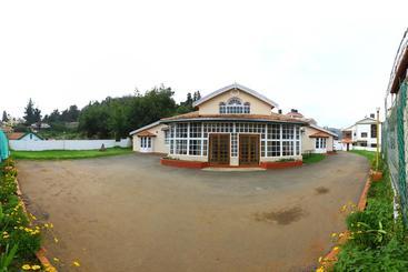 Hotell Oyo 9080 Hillwood Cottages