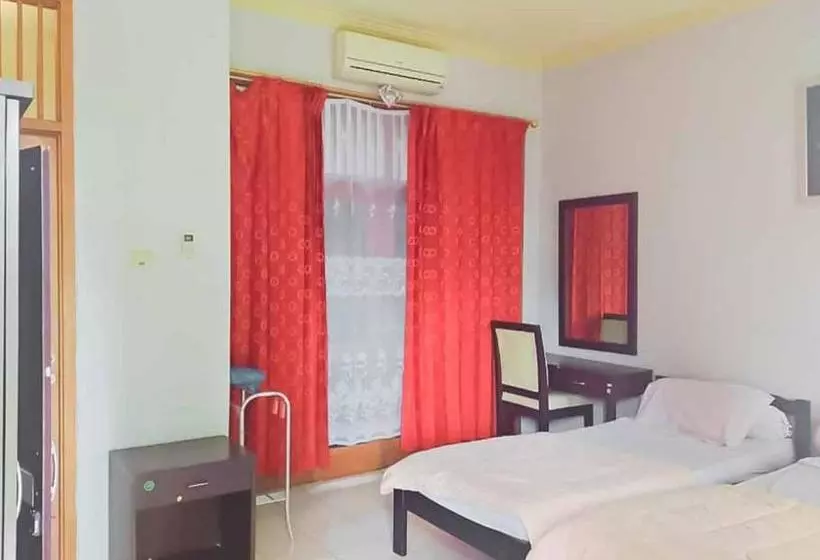 Hotelli Rumah Pahoman Syariah Mitra Reddoorz