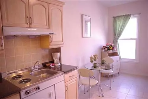 Отель Urban Living Suites