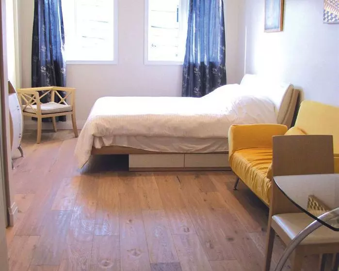 Отель Urban Living Suites