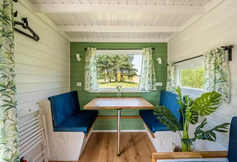 Green Tiny House With Shared Pool