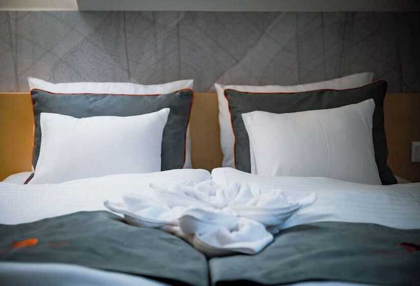 فندق Eleven Business & Sport