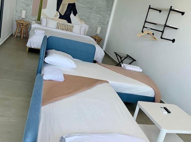 Отель Corcega Beachfront Suites