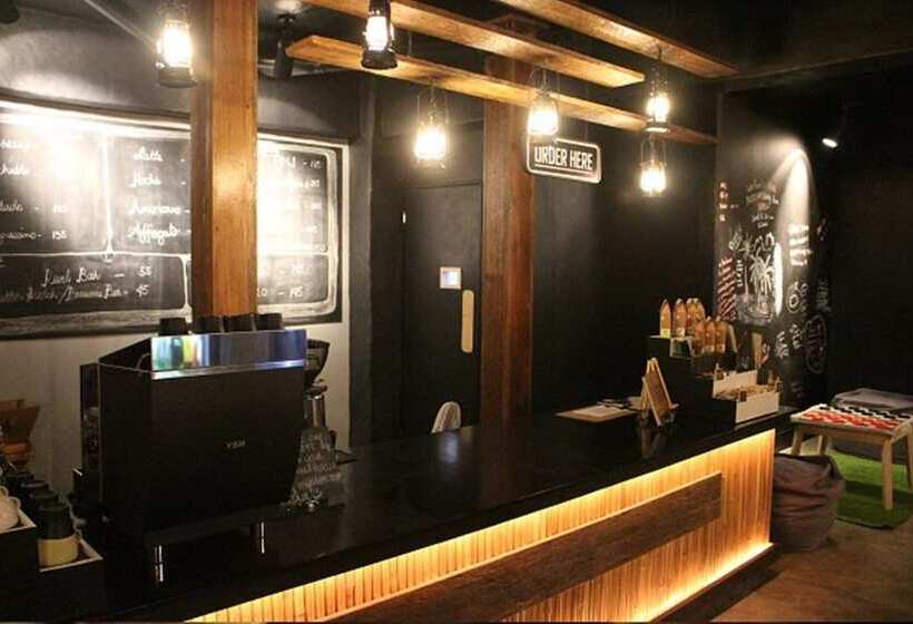 The Cavern Pod Hotel & Specialty Café Hostel