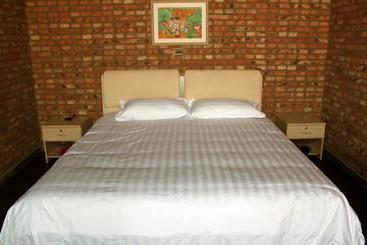 Отель Xin Shuang Quan Resort