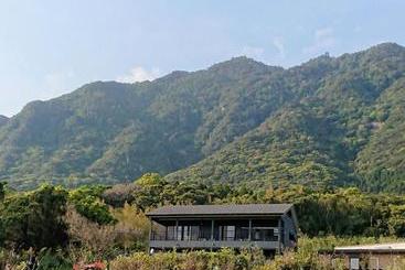 Pension (Hôtel basse catégorie) Yakushima Deaf Farm Guesthouse