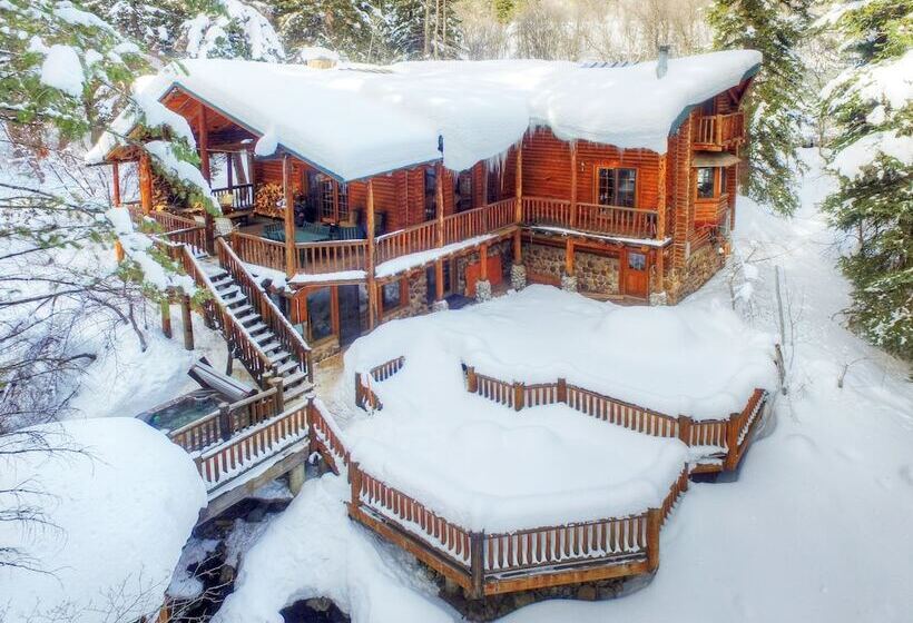 Log Cabin On The Stream