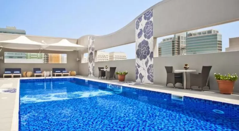 Отель Oaks Liwa Executive Suites