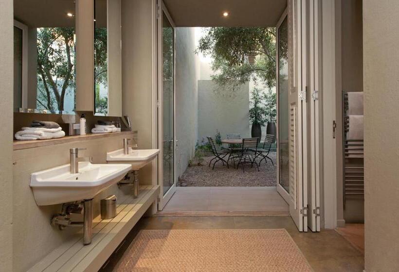 בית מלון כפרי Mosselberg On Grotto Beach