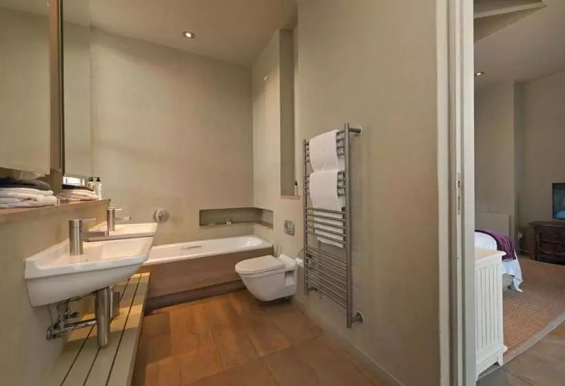 בית מלון כפרי Mosselberg On Grotto Beach