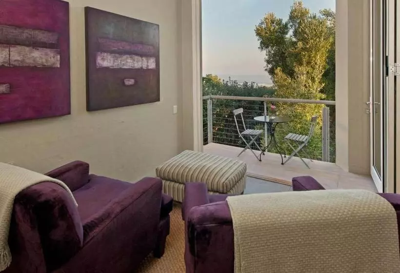 בית מלון כפרי Mosselberg On Grotto Beach