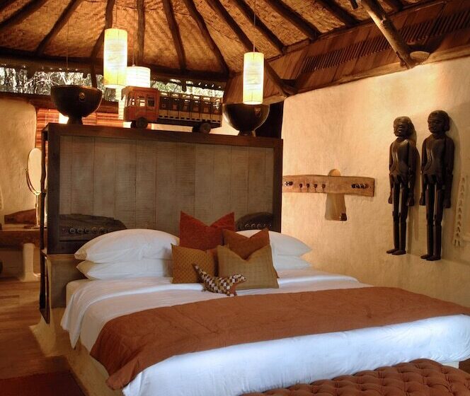 Отель Mahua Kothi Bandhavgarh - A Taj Safari Lodge