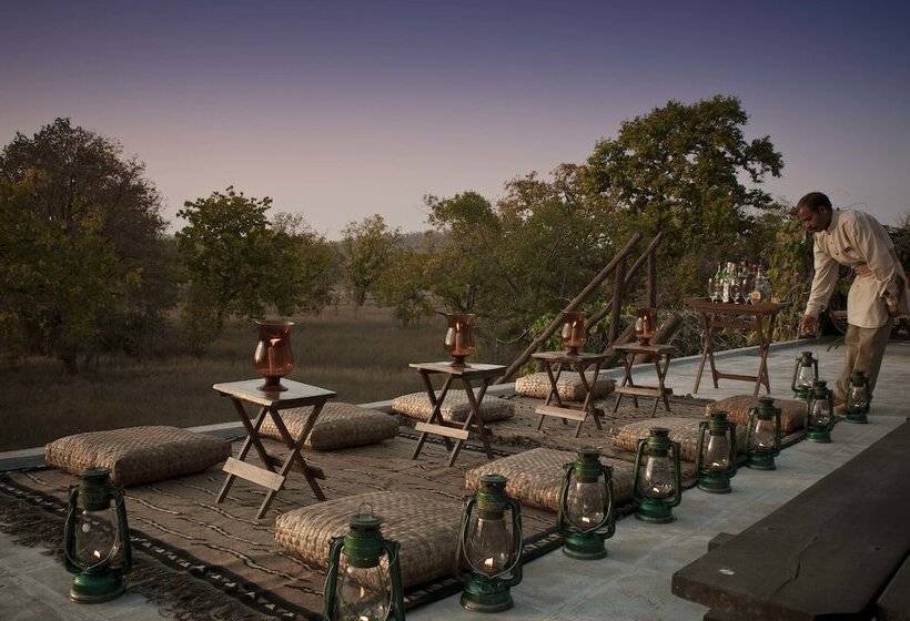 Отель Mahua Kothi Bandhavgarh - A Taj Safari Lodge