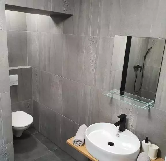 Apartmány černý Kohout