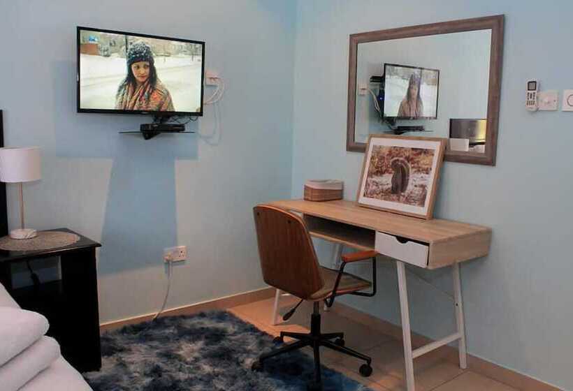 Pension (Hôtel basse catégorie) Serenity River Front Gardens Resort