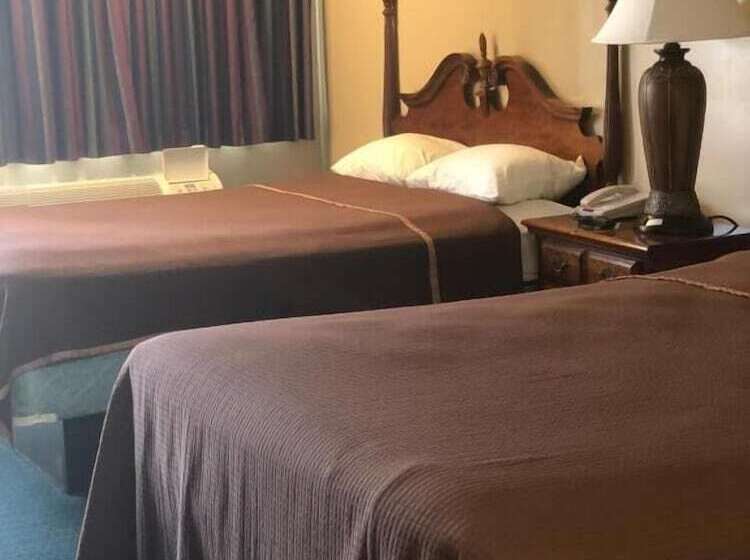 호텔 Travelers Inn