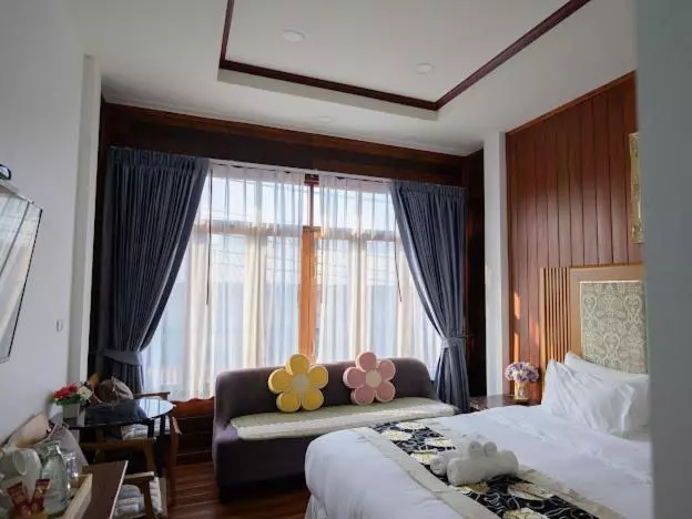 Hotelli โมเมนต์ แอ๊ท ริมโขง