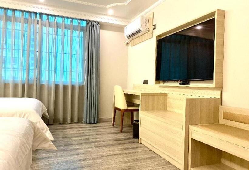 בית מלון כפרי Jtour Inn Maoming Huazhou Beijing Road Railway Station