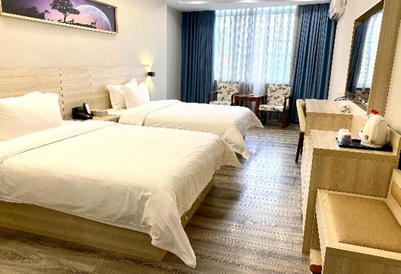 בית מלון כפרי Jtour Inn Maoming Huazhou Beijing Road Railway Station