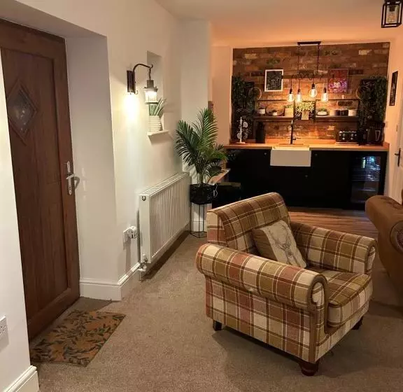 ペンション The Coachmans Cottage