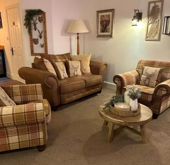 ペンション The Coachmans Cottage