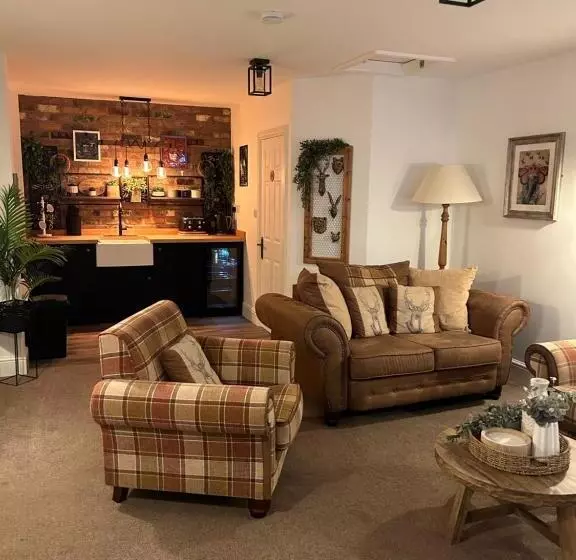 ペンション The Coachmans Cottage