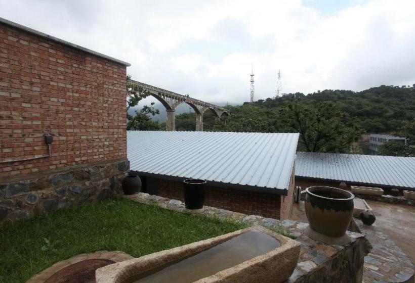 Отель Xin Shuang Quan Resort