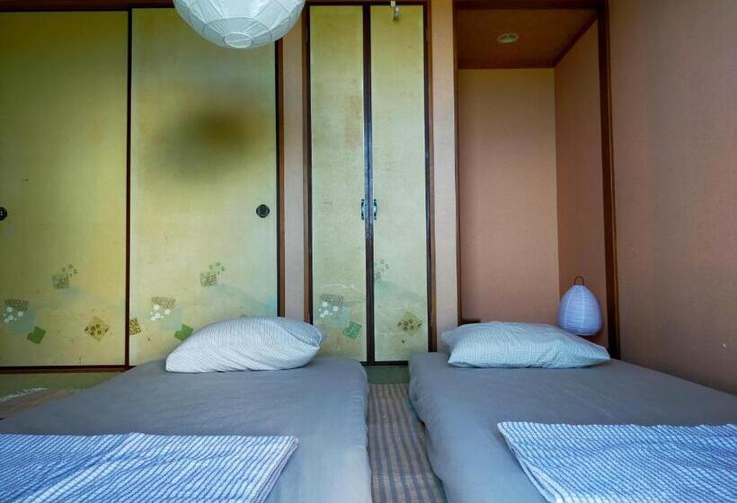 پانسیون 奄美ゲストハウス宇宿サンライズビーチ