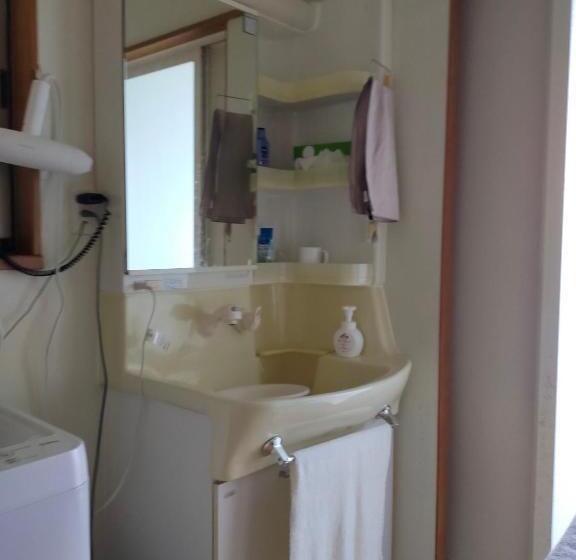 پانسیون 奄美ゲストハウス宇宿サンライズビーチ