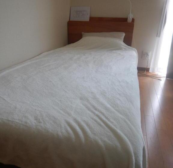 پانسیون 奄美ゲストハウス宇宿サンライズビーチ