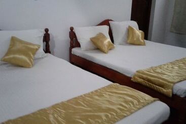 Pension (Hôtel basse catégorie) The Rock Bunglow