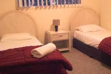 酒店 Champelli Palms Apartments