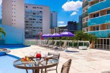 Flat Hotel Morador 1110 Suíte,sofá,varanda,cozinha