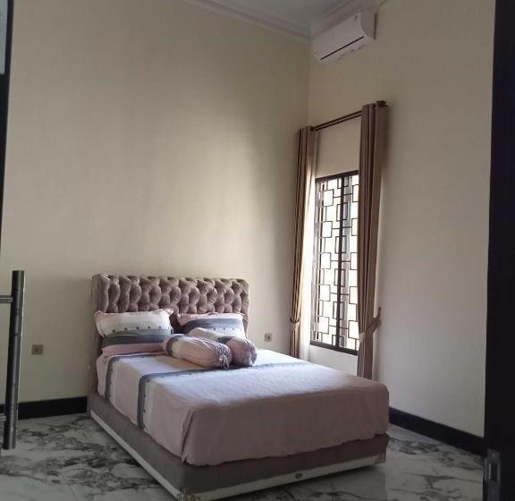 Hotel Express O 91708 Rumah Sriwijaya 12a Syariah