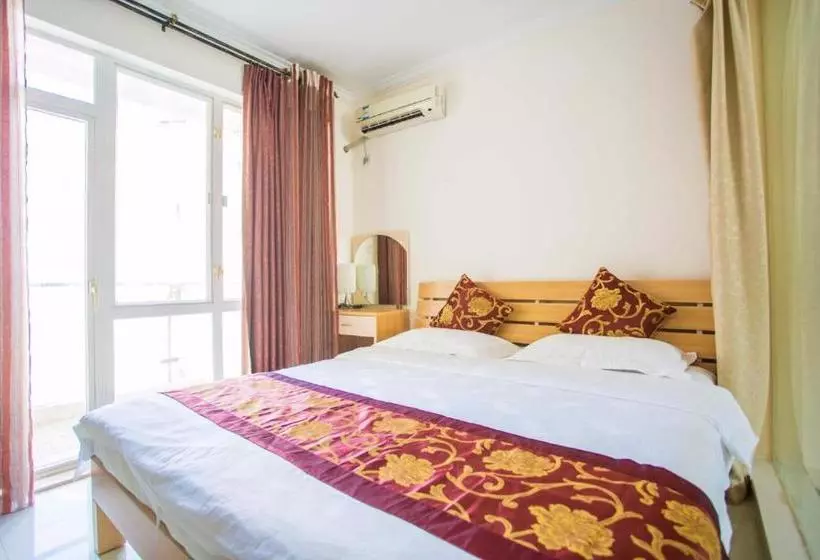 هتل Sanya Sunshine Holiday Apartment (yalong