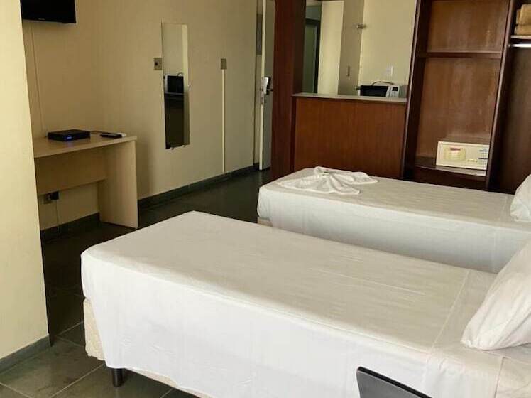 Отель Bravo Suites