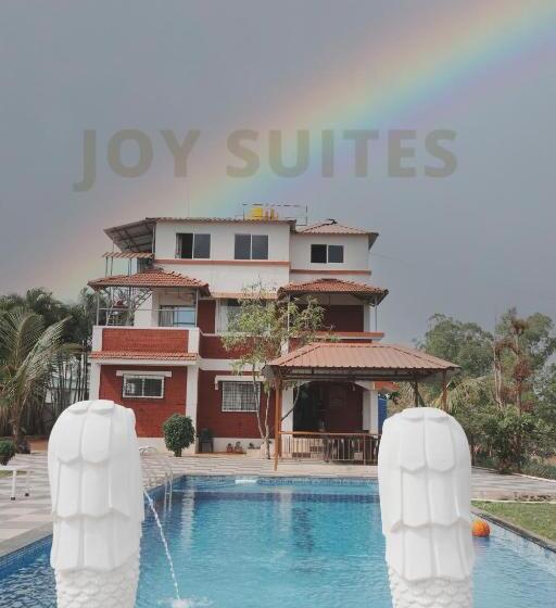 Отель Green Mountain Cottages By Joy Suites