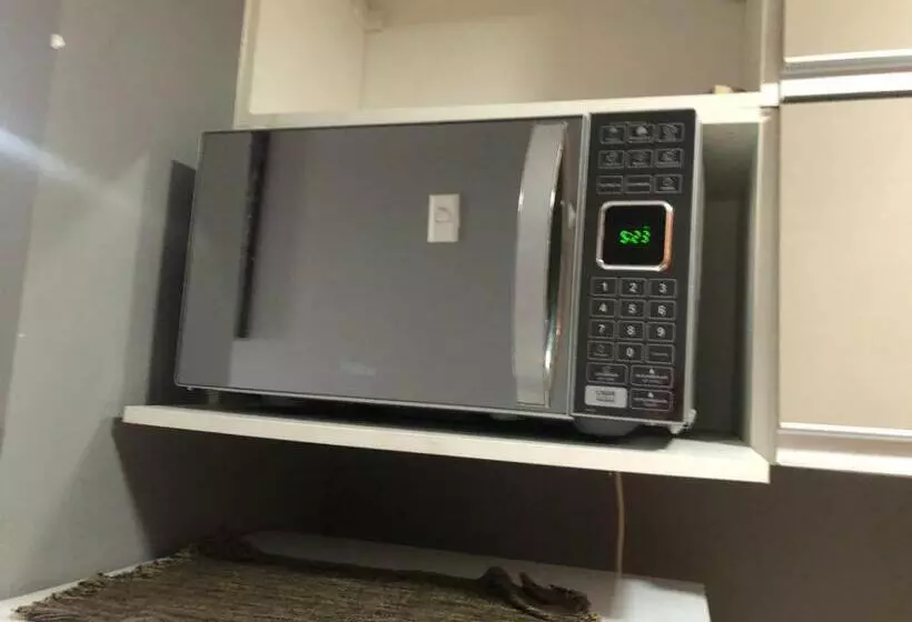 Flat Hotel Morador 1110 Suíte,sofá,varanda,cozinha